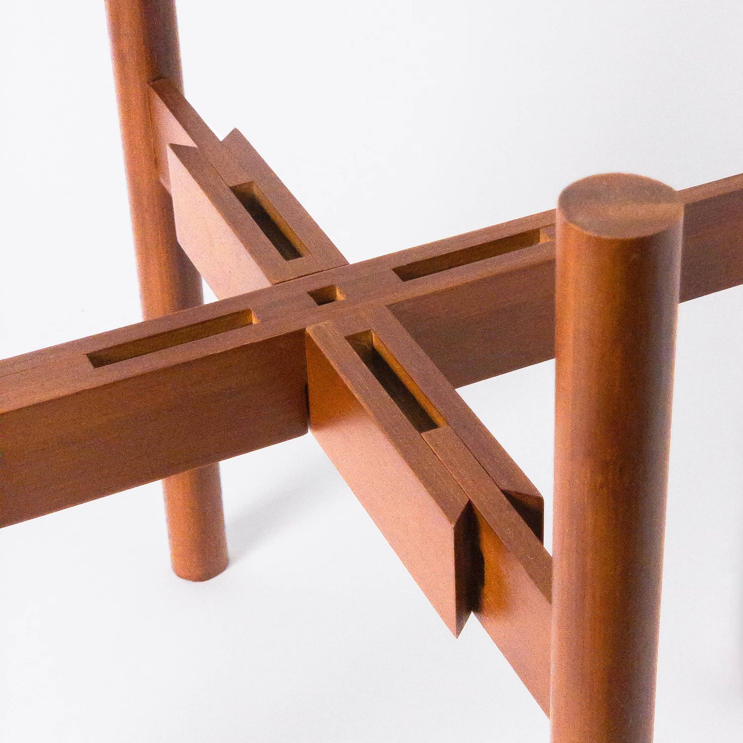 Close-up of the stylish adjustable bamboo 'Aspen' plant stand from Luxe Leaf Decor. Its sleek, minimalist design makes it the perfect accent for any contemporary space.